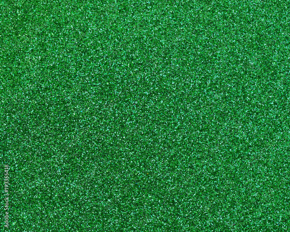 Fototapeta premium Green glitter texture abstract background close up