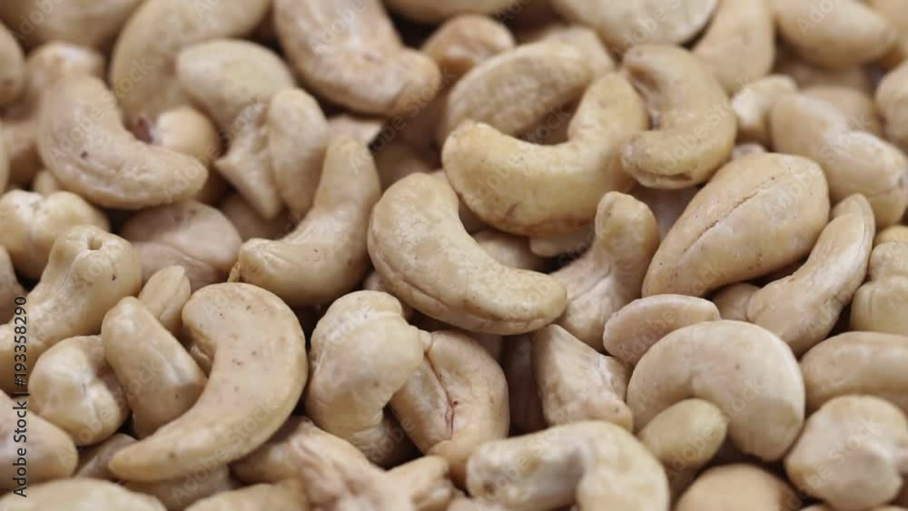 Cashew closeup. Rotating nuts background Cashew closeup. Rotating nuts background