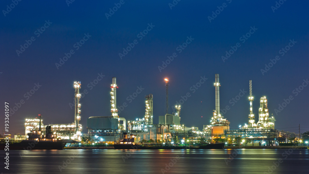 Oil and gas refinery with reflection in water - Petrochemical factory