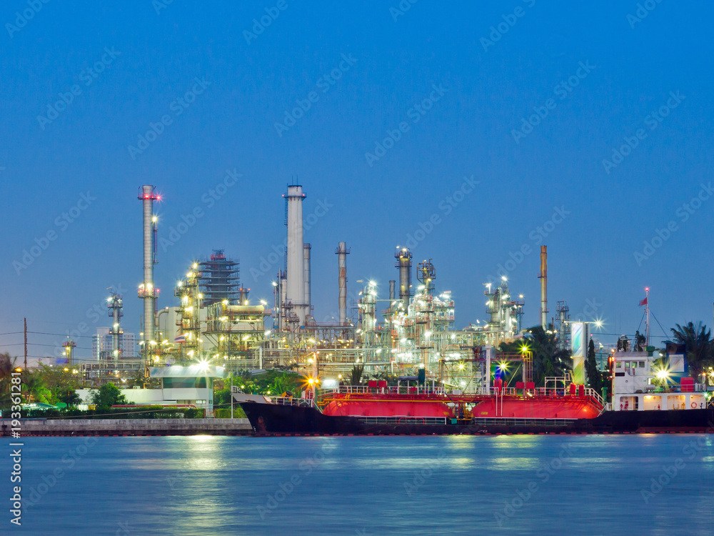 Oil and gas refinery with reflection in water - Petrochemical factory