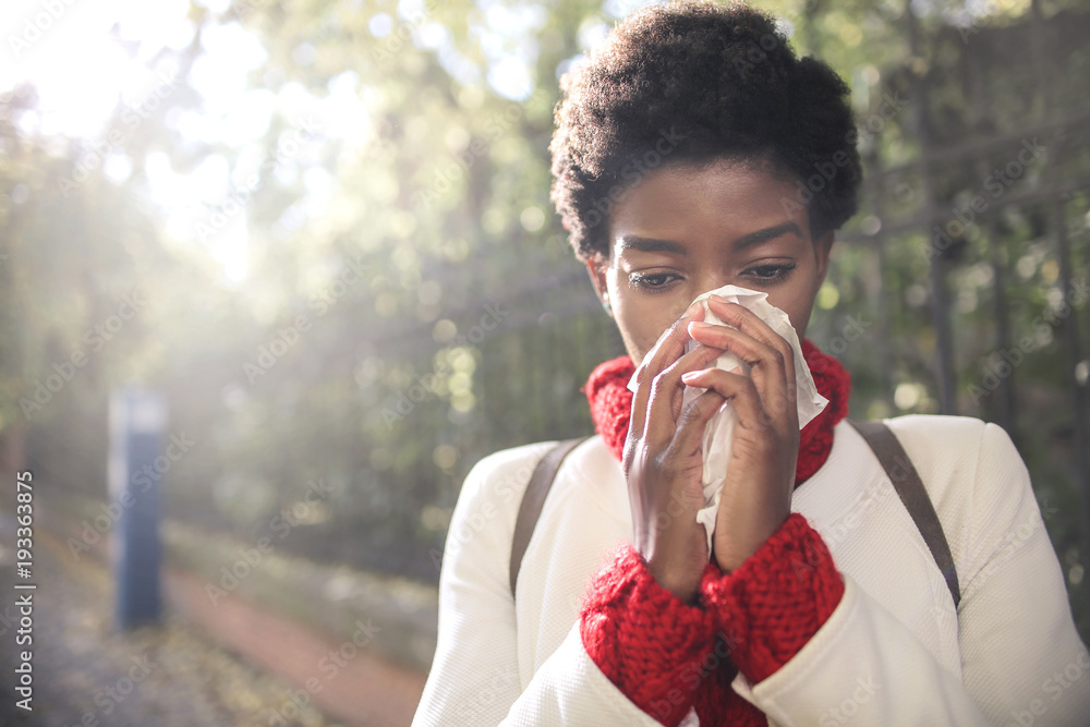 Girl blowing her nose with a handkerchief Stock Photo Adobe Stock