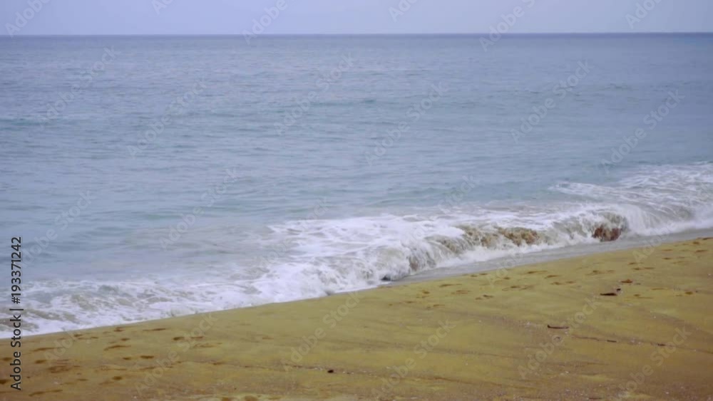 Powerful wave breaks along the shore Powerful wave breaks along the shore
