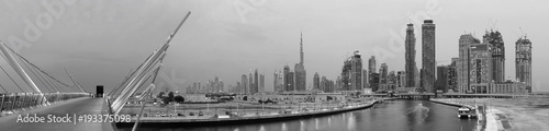 DUBAI  UAE - MARCH 27  2017  The evening skyline with the bridge over the new Canal and Downtown.