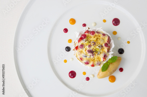 Fototapeta Beautiful elegant colorful dessert in a plate