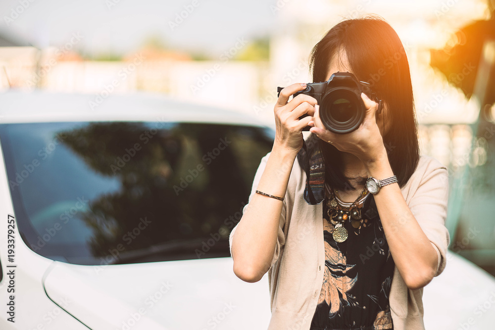 young woman taking a photo at home.