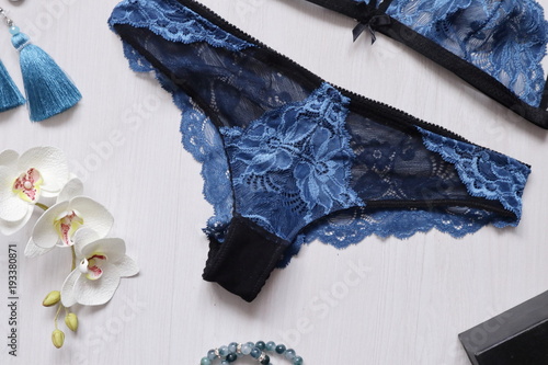 Blue lace lingerie on the white background with fasion women accessories. Sexy woman underwear