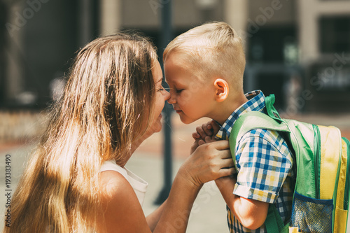Valokuva Mother and Little Son Touching Noses Before School