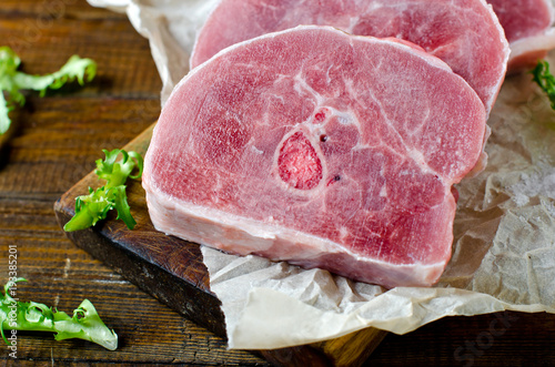 Raw turkey steak on a wooden cutting board. Healthy eating. Diet.