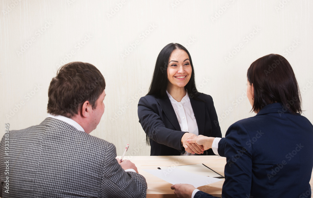 Young woman during job interview and members of managemen. Job offer concept. Young woman during job interview and members of managemen. Job offer concept.