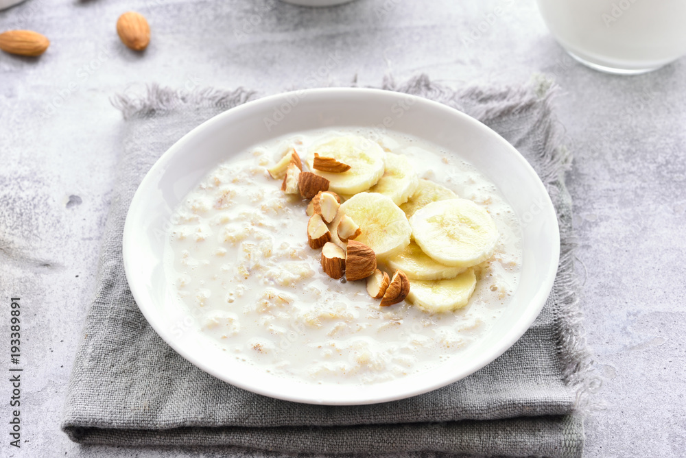 Oatmeal porridge with banana slices and nuts Oatmeal porridge with banana slices and nuts