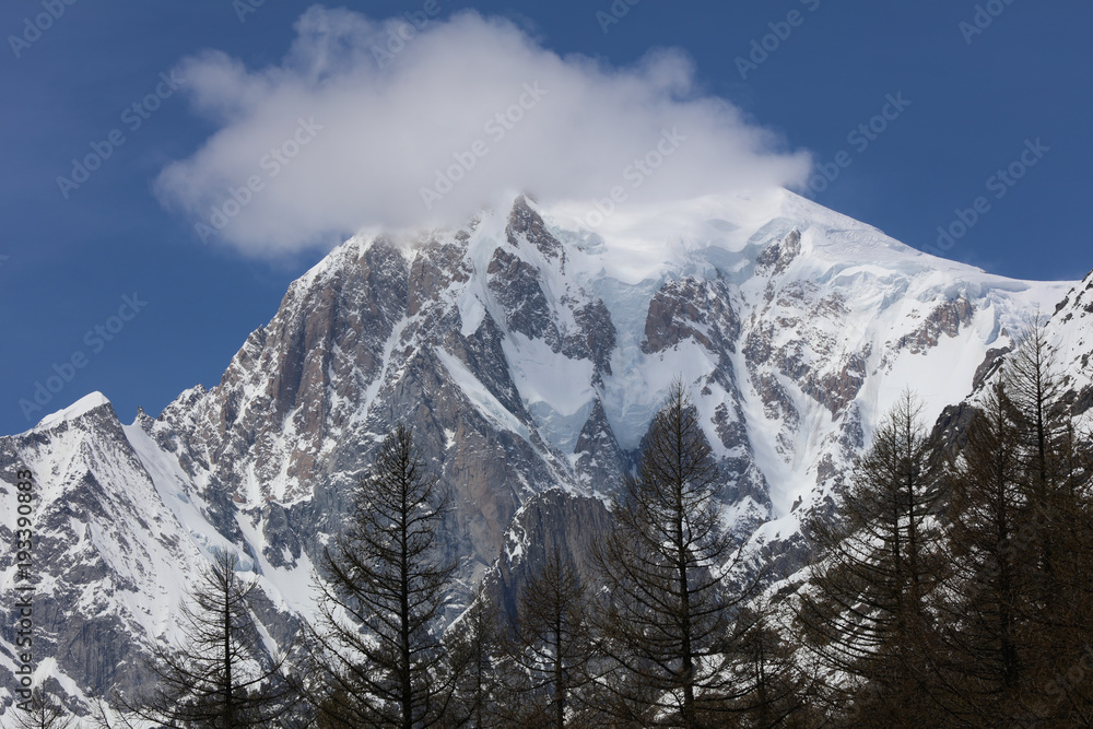Mont Blanc Summit with clouds from Courmayeur. Italy