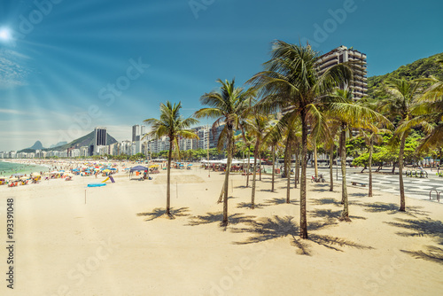 Copacabana Beach with palms. Light effect applied. Rio de Janeiro, Brazil