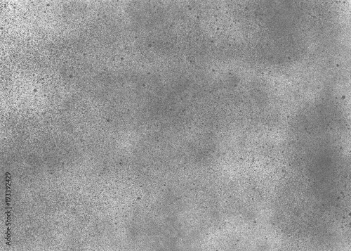 Subtle grain texture. Abstract black and white gritty grunge background. Dark paint spray particles on paper