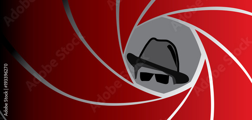 Silhouette of spy, secret agent, detective or gangster in fedora hat and sunglasses seen through a gun barrel. Vector illustration.