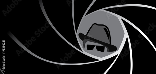 Silhouette of spy, secret agent, detective or gangster in fedora hat and sunglasses seen through a gun barrel. Vector illustration.