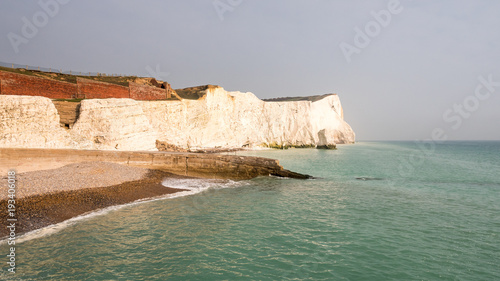 Seaford chalk cliffs, East Sussex, England. The white cliffs of the South Downs on England's southern coast on a calm dusky evening.