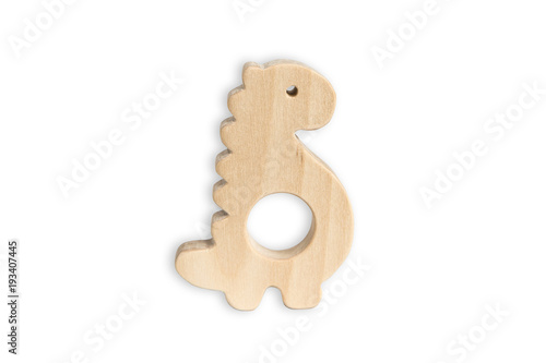 Organic baby teether isolated on white background. Wooden dinosaur toy for babies.