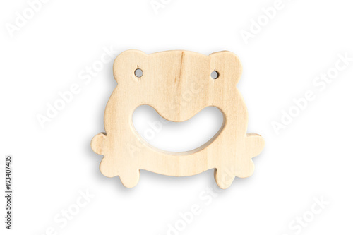 Organic baby teether isolated on white background. Wooden frog toy for babies.  photo