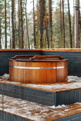outdoor bathhouse in forest © Maksim Shebeko