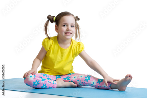Kid girl doing fitness exer...