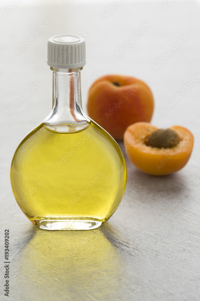 Glass bottle with cosmetic apricot kernel oil Glass bottle with cosmetic apricot kernel oil