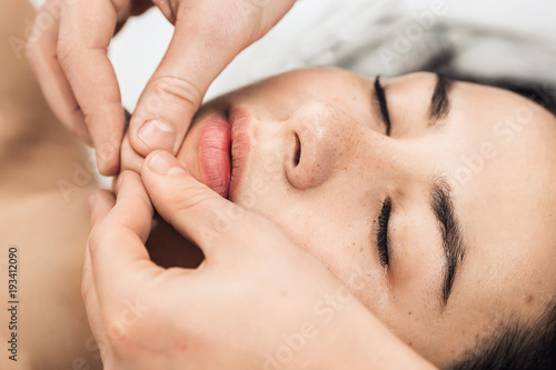 Professional facial massage (chin).