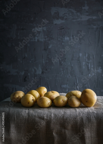 young, potato dark bacround moody food photo