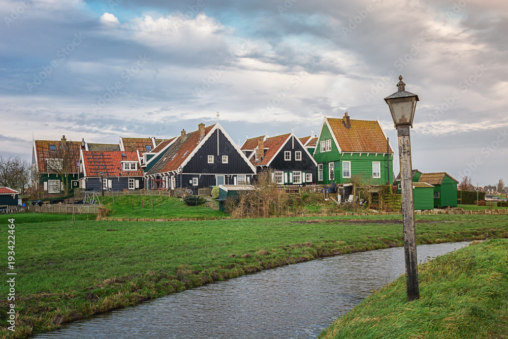 Hamlet with its typical wooden houses on the island of Marken in the Netherlands Hamlet with its typical wooden houses on the island of Marken in the Netherlands