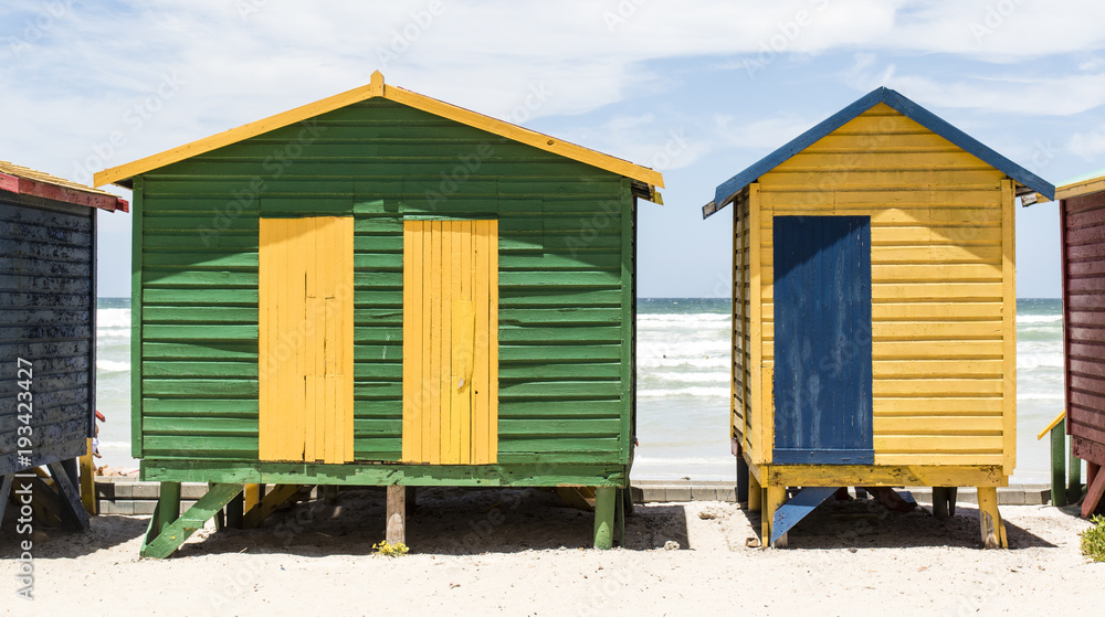 Colorful huts/ houses along the beach in Muizenberg, South Africa Colorful huts/ houses along the beach in Muizenberg, South Africa
