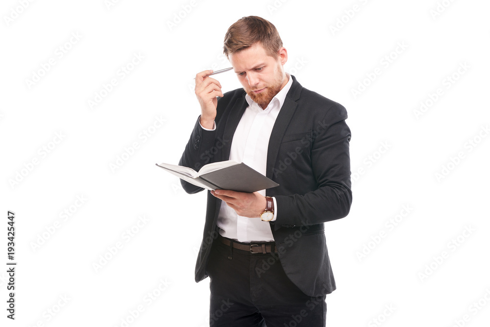 Portrait of young manager holding personal organizer on white background