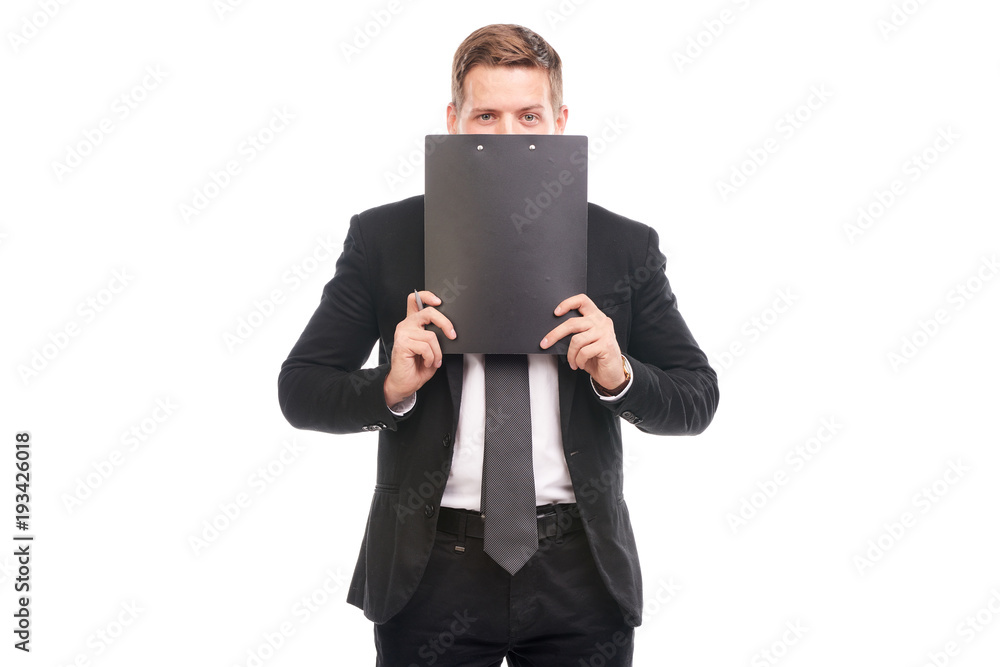 Studio portrait of business coach holding clipboard Studio portrait of business coach holding clipboard