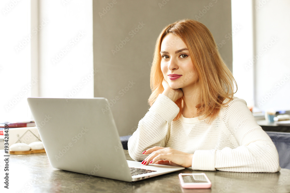Attractive hipster young woman in modern loft cafe coffee shop restaurant. Writer, blogger, designer, freelancer, remote work process. E-shopping, online shopping, m-shopping. Attractive hipster young woman in modern loft cafe coffee shop restaurant. Writer, blogger, designer, freelancer, remote work process. E-shopping, online shopping, m-shopping.