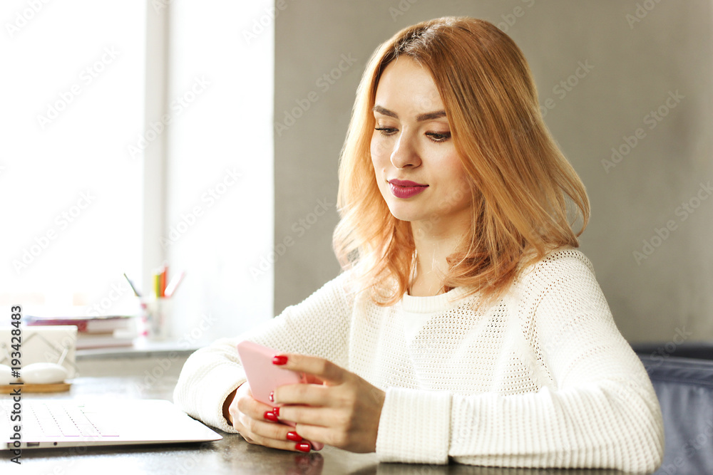 Attractive hipster young woman in modern loft cafe coffee shop restaurant. Writer, blogger, designer, freelancer, remote work process. E-shopping, online shopping, m-shopping. Attractive hipster young woman in modern loft cafe coffee shop restaurant. Writer, blogger, designer, freelancer, remote work process. E-shopping, online shopping, m-shopping.