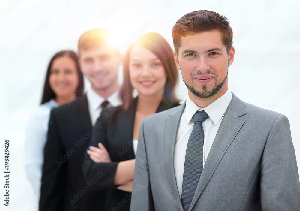 leader and the business team standing one behind the other. leader and the business team standing one behind the other.