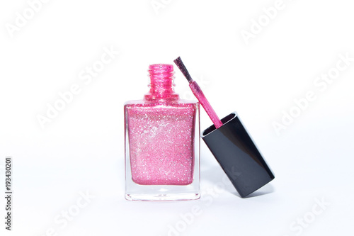 Pink nail Polish bottle on white background.