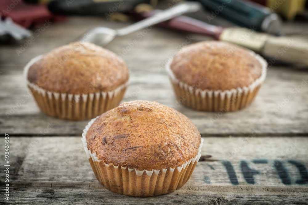 Banana Cupcake On the Tool Wooden Table. Banana Cupcake On the Tool Wooden Table.