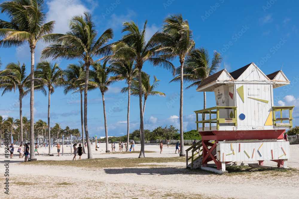 Lifeguard tower in a colorful Art Deco style, with blue sky and Atlantic Ocean in the background. World famous travel location. Miami Beach. Lifeguard tower in a colorful Art Deco style, with blue sky and Atlantic Ocean in the background. World famous travel location. Miami Beach.