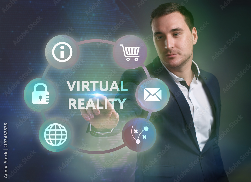 Business, Technology, Internet and network concept. Young businessman working on a virtual screen of the future and sees the inscription: Virtual reality Business, Technology, Internet and network concept. Young businessman working on a virtual screen of the future and sees the inscription: Virtual reality