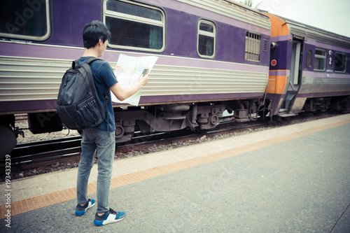 traveler with map at train station