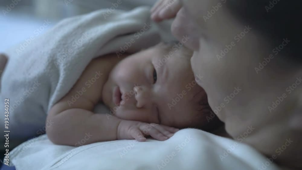 Mother touches her baby while having a hiccup
Mother touches her baby while having a hiccup