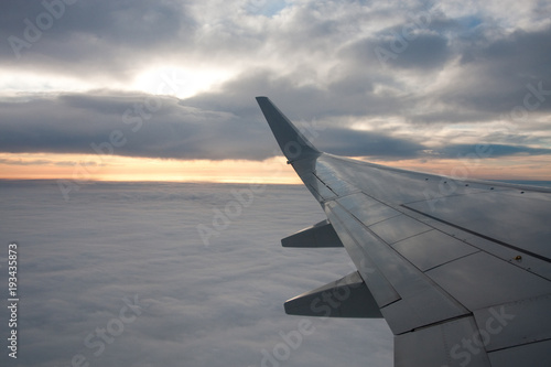 Clouds, airliner wing
