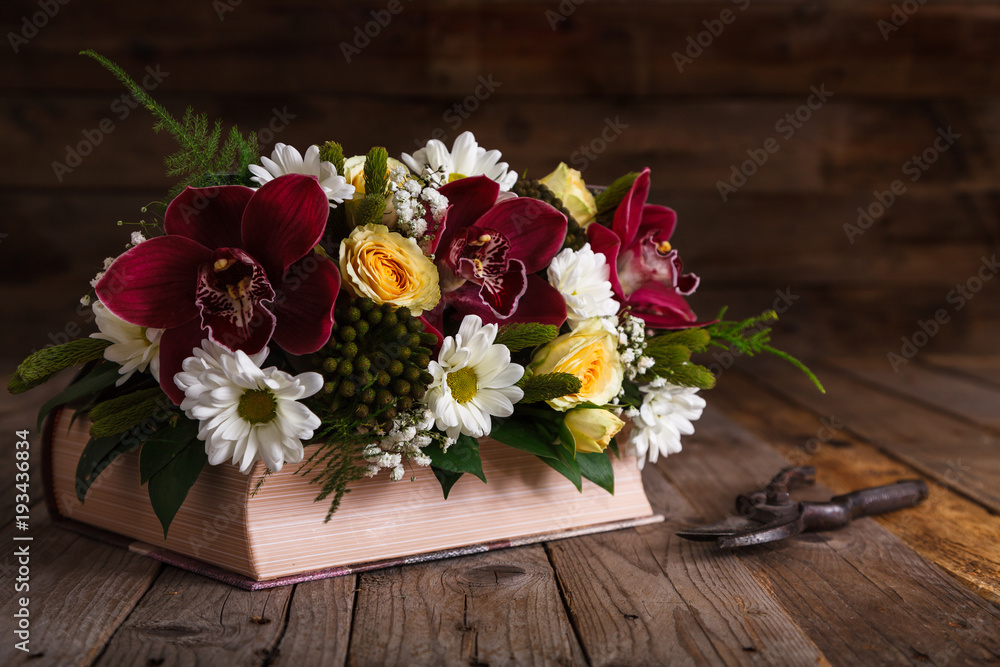 rustic flower arrangements on an old wooden table.