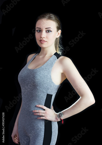 Fotografie Slim athletic girl on a black background
