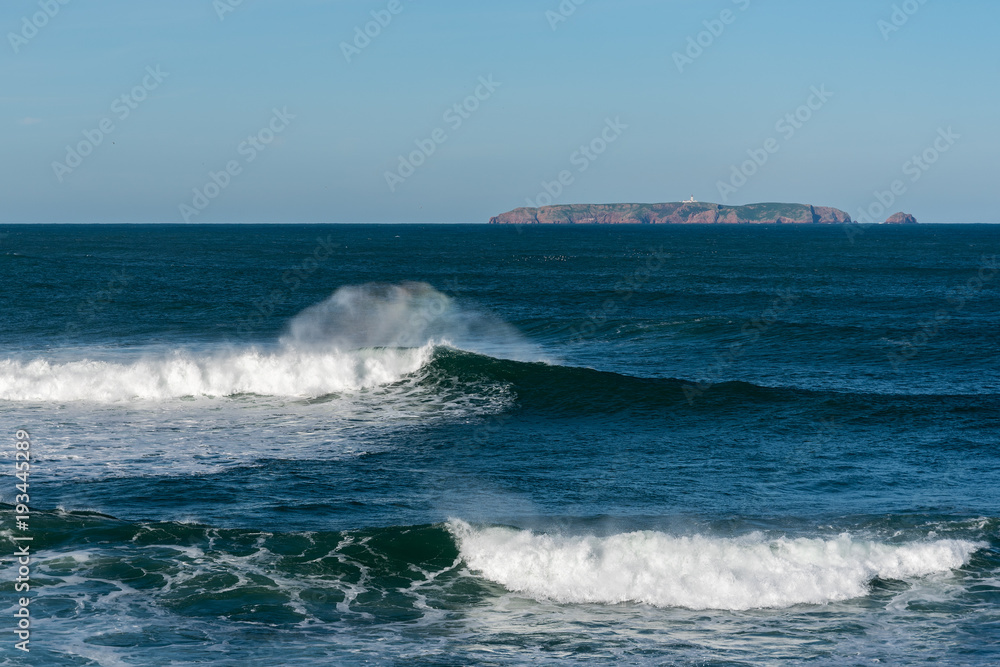 Atlantic ocean foamy waves near Peniche , Portugal.