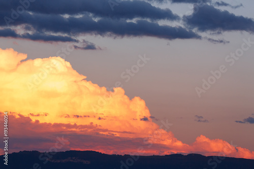 big clouds in the sky before the rain. sunset with the horizon. dark blue sky. image of nature without people