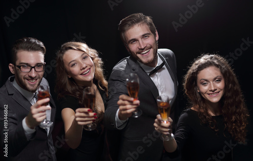happy young people with a glass of wine.