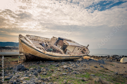 Shipwreck at the coastline of a small cretan fishing village. Once upon the time it was sailing to the aegean sea.