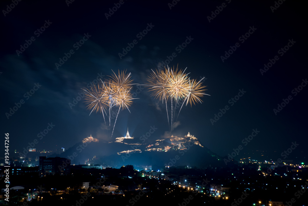 Beautiful gold fireworks at night with temple on mountain view Beautiful gold fireworks at night with temple on mountain view