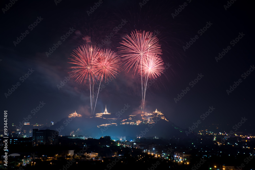 Beautiful red fireworks at night with temple on mountain view
