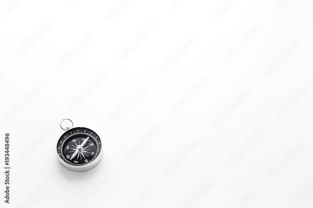 Compass on white background top view copy space. Black and white, contrast